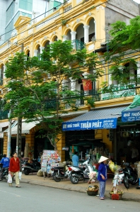 All you need to when strolling around central Saigon is look up, and behind the chaos you'll see many beautiful colonial French shop fronts.